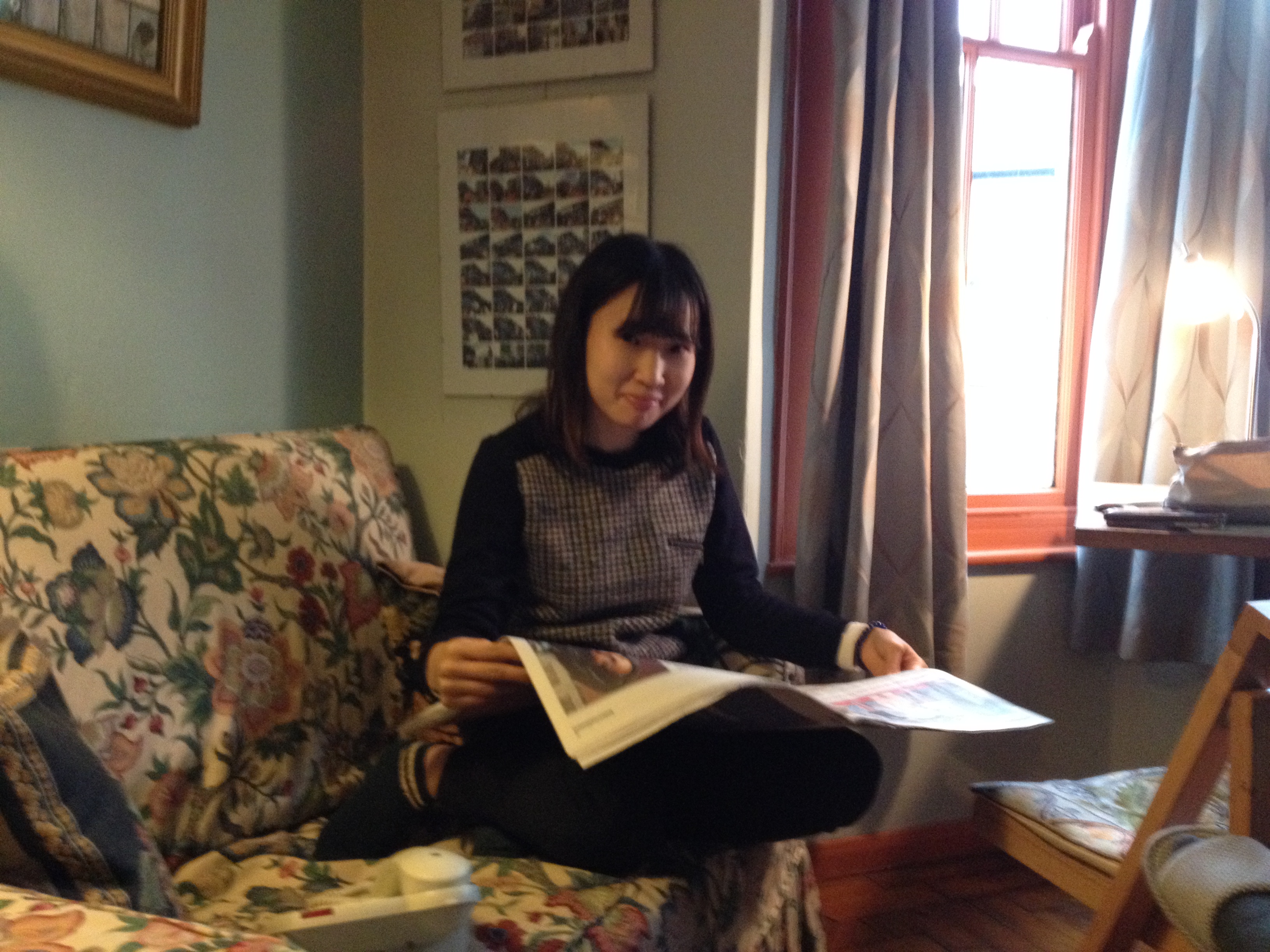 Elaine's student reading a newspaper